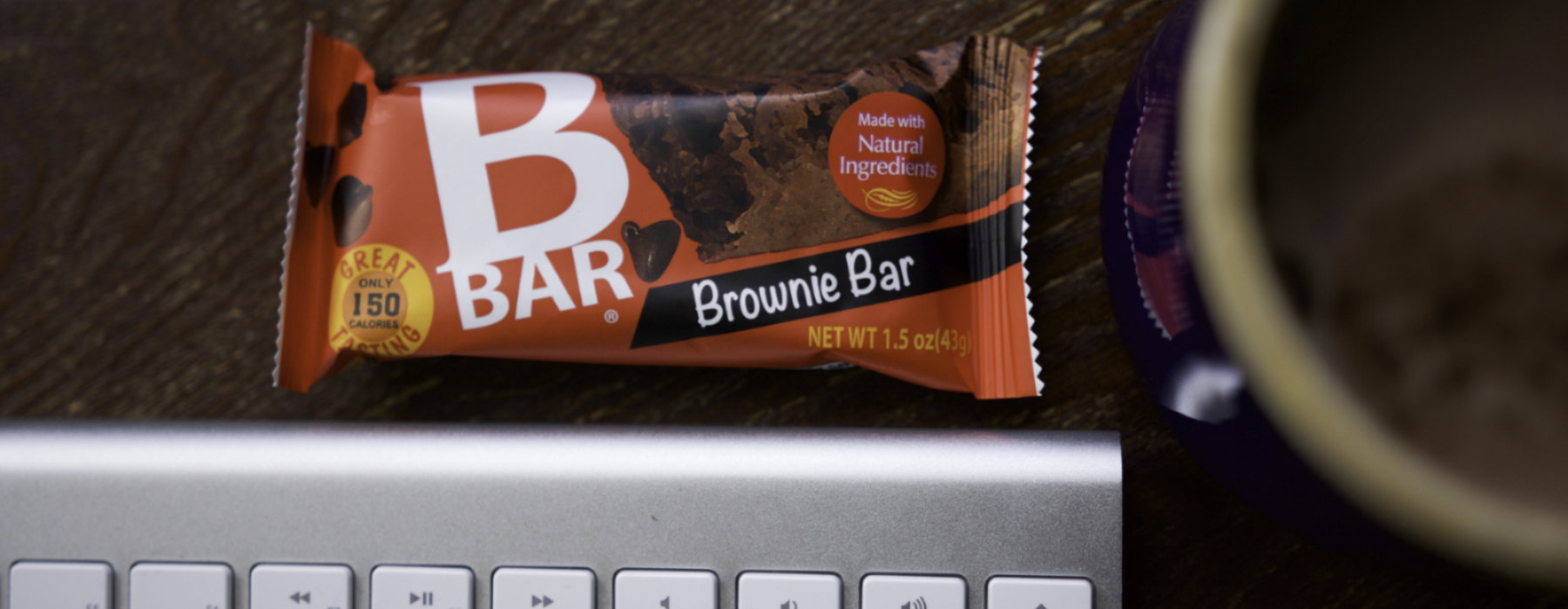 Bbar Brownie bar on a desk next to coffee